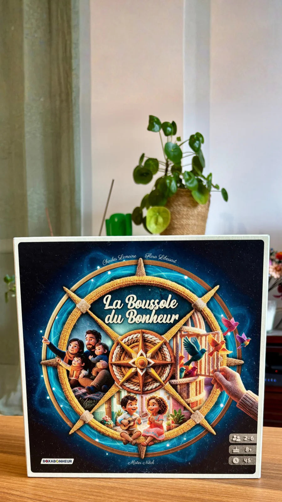 Une famille réunie autour de La Boussole du Bonheur